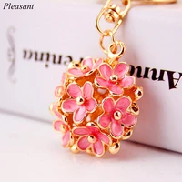 new exquisite enamel lucky flower keychain female bag accessories metal pendant three dimensional hollow flower keychain