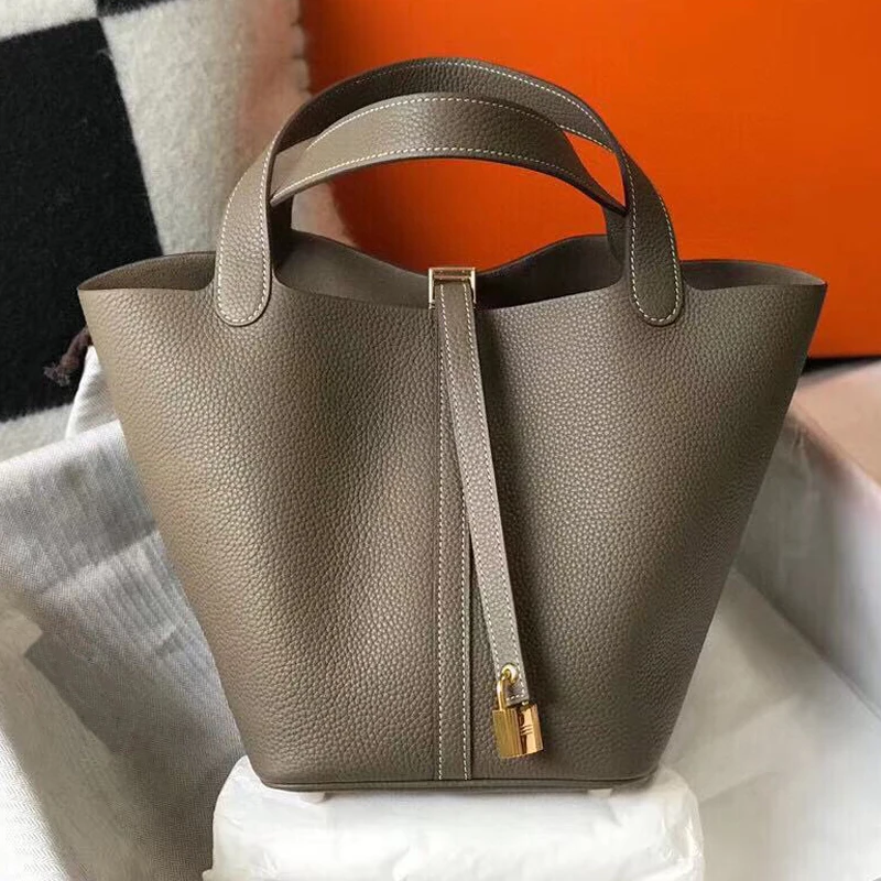 

Женская сумка из натуральной кожи, с ручками и плечевым ремнём