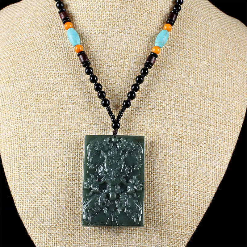 

Xinjiang hetian jade qingyu jiuzhu jade brand zodiac dragon head pendant