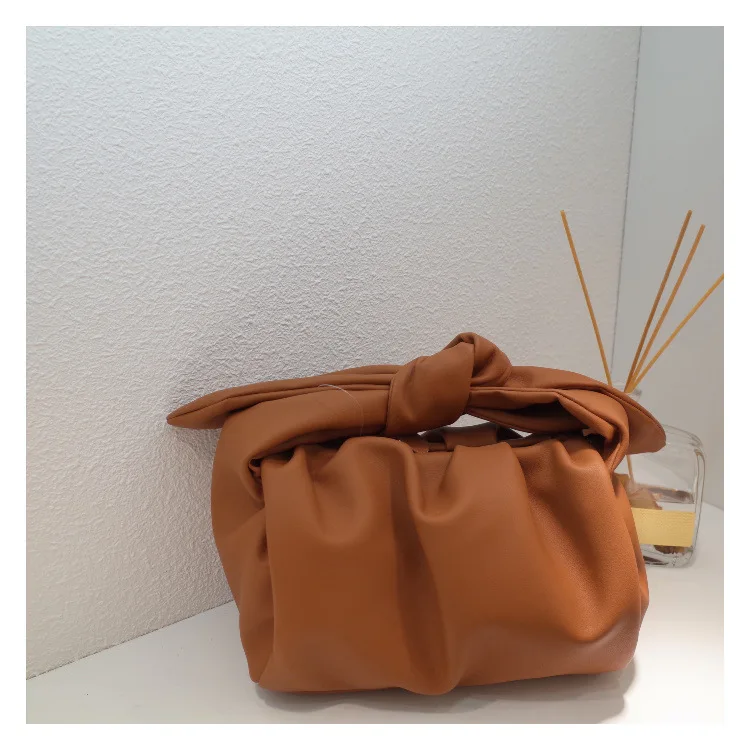 

Cowhide Leather Pleated Lunch Bag Bunny ears Barrel Bag with Bow Hand Holding Cloud Bag Luxury Brand Dumpling Bag