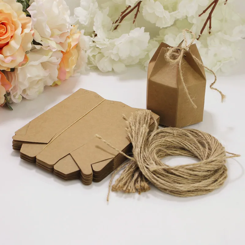 

CN 100pcs Creative Kraft Paper Candy Gift Boxes Lantern Hexagon Shape Wedding Favors Cake Gift Packaging Boxes Dragees Box Bags