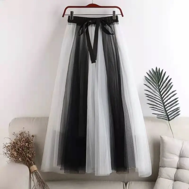 

Korean version ins new splicing female fairy spring and summer skirt medium length high waist big swing mesh A-line skirt
