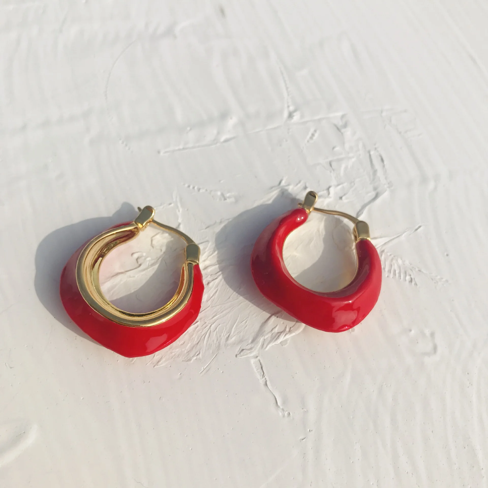 

Woman Enamel Gold Earring