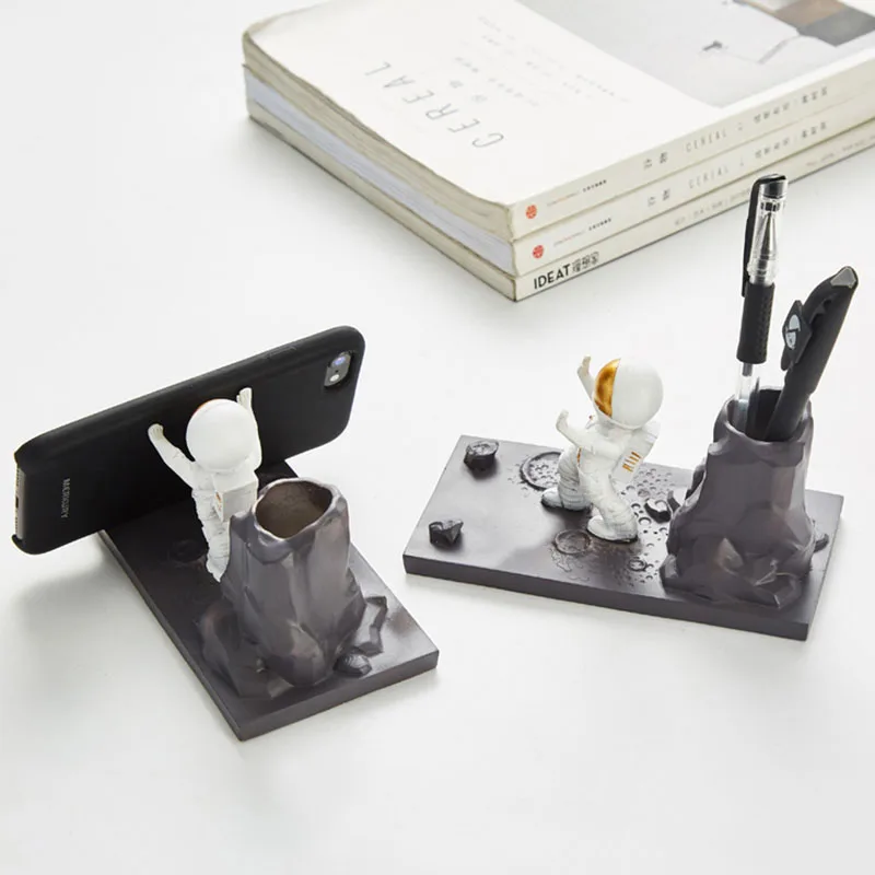 creative penholder mobile phone stand resin astronaut figurine home decoration office desk accessories practical desktop holder free global shipping