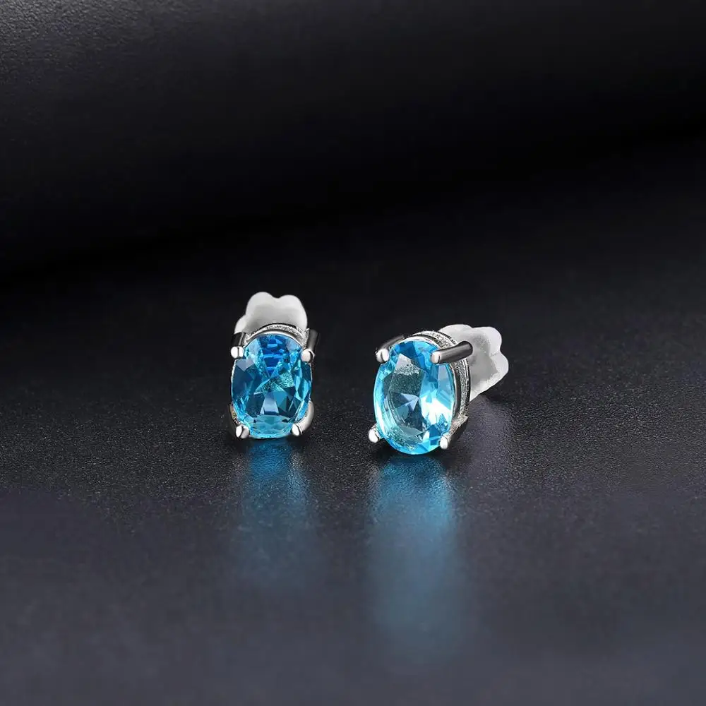 Серьги-гвоздики из серебра 925 пробы с голубым топазом 7*5 мм овальный камень