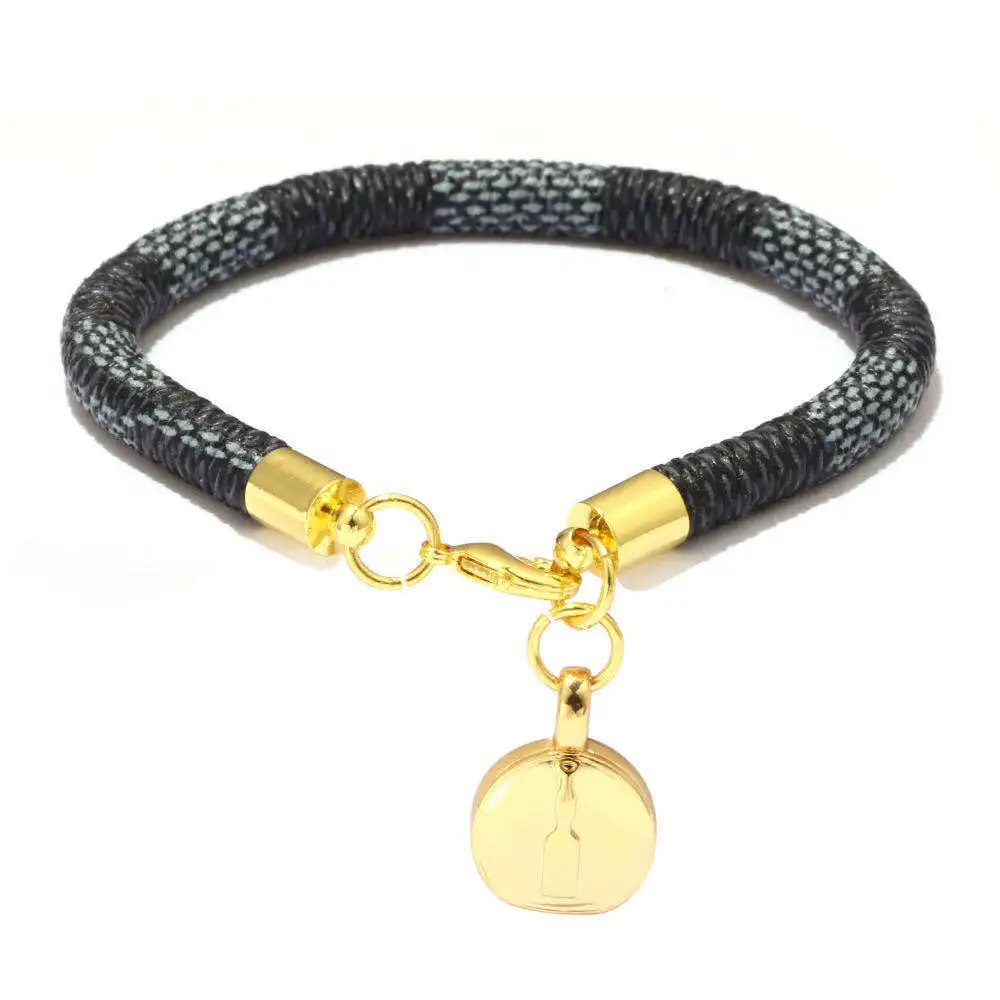 

Fashion trendy leather grain leather bracelet, mini bag, round small bag pendant, electroplated real gold bracelet