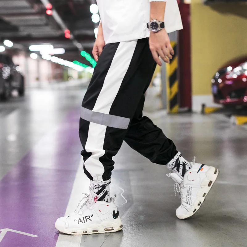 

Men Streetwear Reflective Joggers Pants 2020 Man Korean Fashion Hip Hop Sweatpants Couple Side Striped Trousers