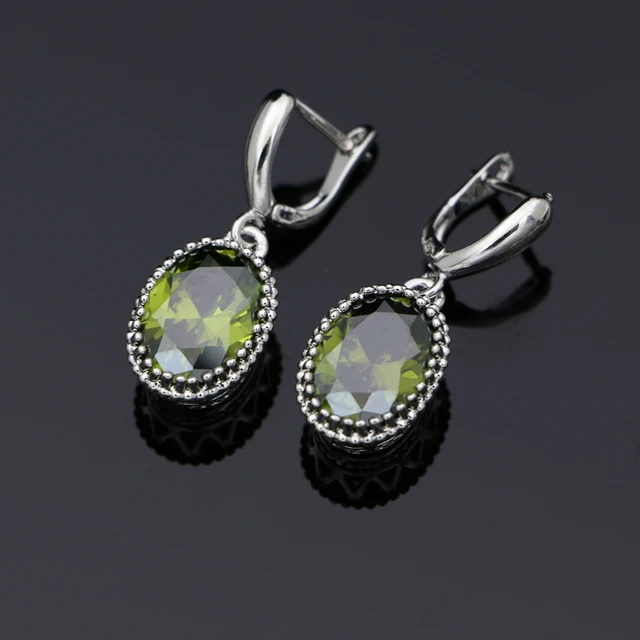 Серьги капельки сваровски. Серьги с камнями 925. Серьги swarovski 925sl. Серьга из серебра с фианитом 94170223. Серебряные сережки с зеленым камнем.
