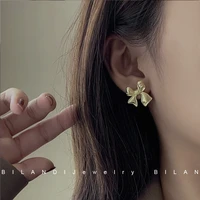 s925 needle bowknot earring hot selling sweet korean jewelry metal alloy shiny golden gift earrings for girl women party wedding