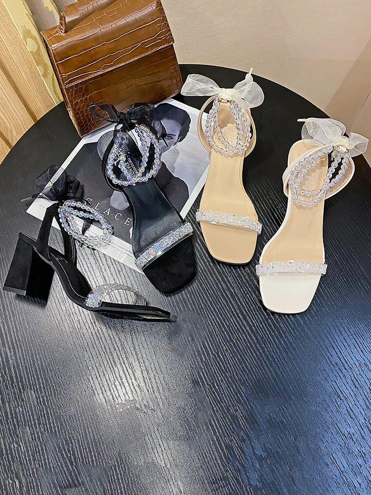 

Sandals women 2021 new summer pearl temperament crystal pearl one word lace bow high heels