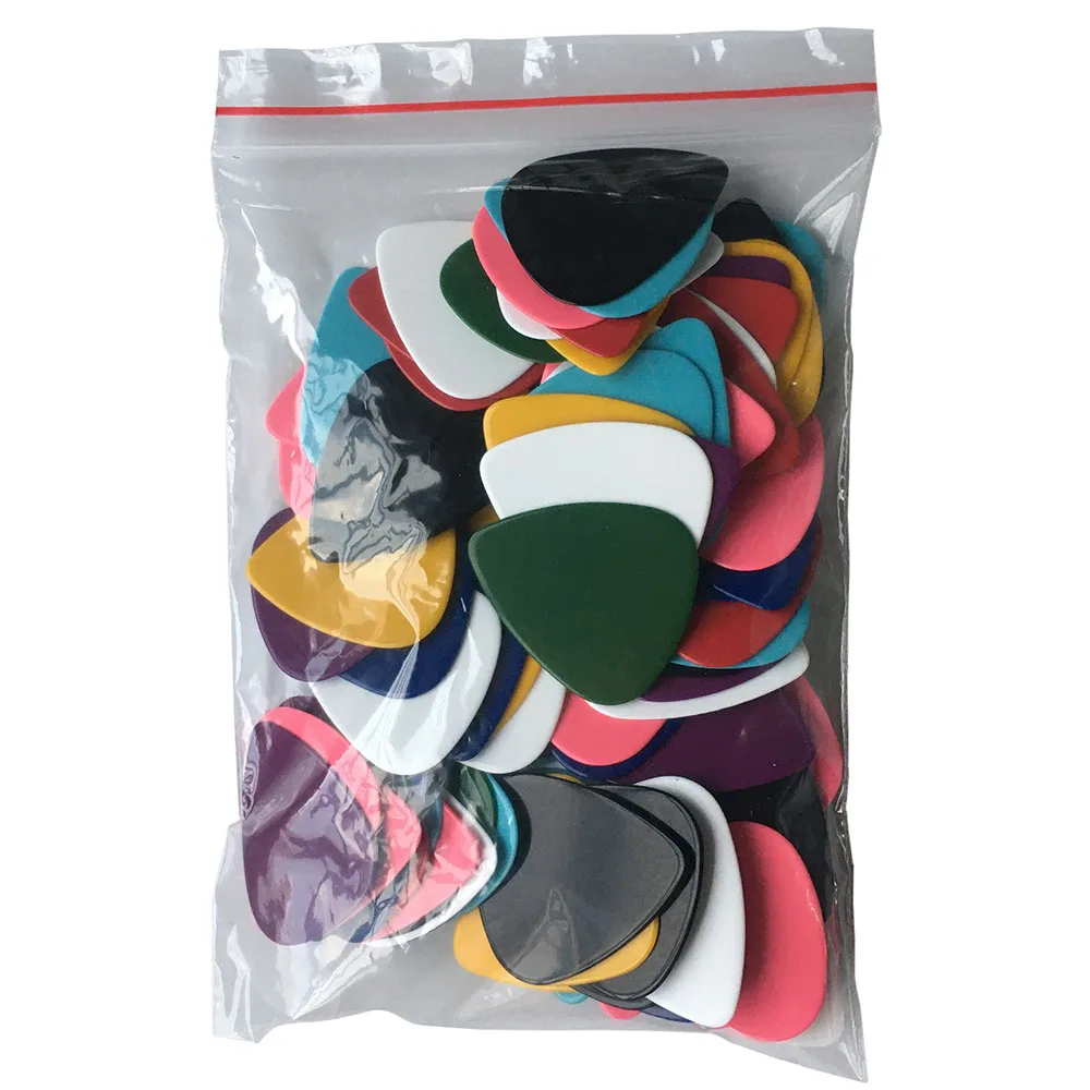 

Lots of 100pcs 0.71mm Medium Celluloid Guitar Picks Plectrums Solid Colors Mixed