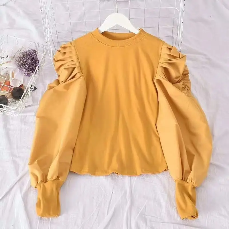 

2020 new Korean knitted stitched bubble sleeve long sleeve slim fashion design sense solid color base coat