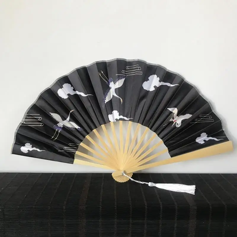

2021 Ethnic Handicrafts Silk Folding Fan Wooden Shank Classical Dance Fan High Quality Tassel Elegent Female Fan Home Decoration