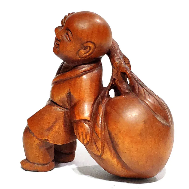 

Y6795 - 2" Hand Carved Boxwood Netsuke : Boy with Peach