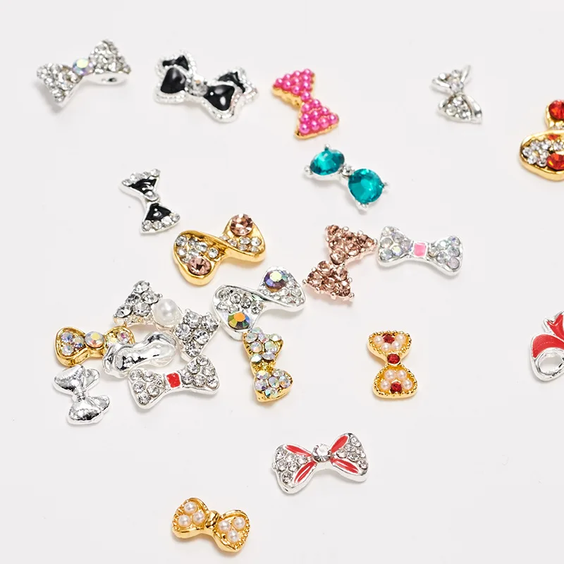 

10pcs High Quality Hot Nail Art Jewelry Rhinestone Pearl Embellished Color Bow Nails Nail Drill DIY Nail Art Jewelry Decoration