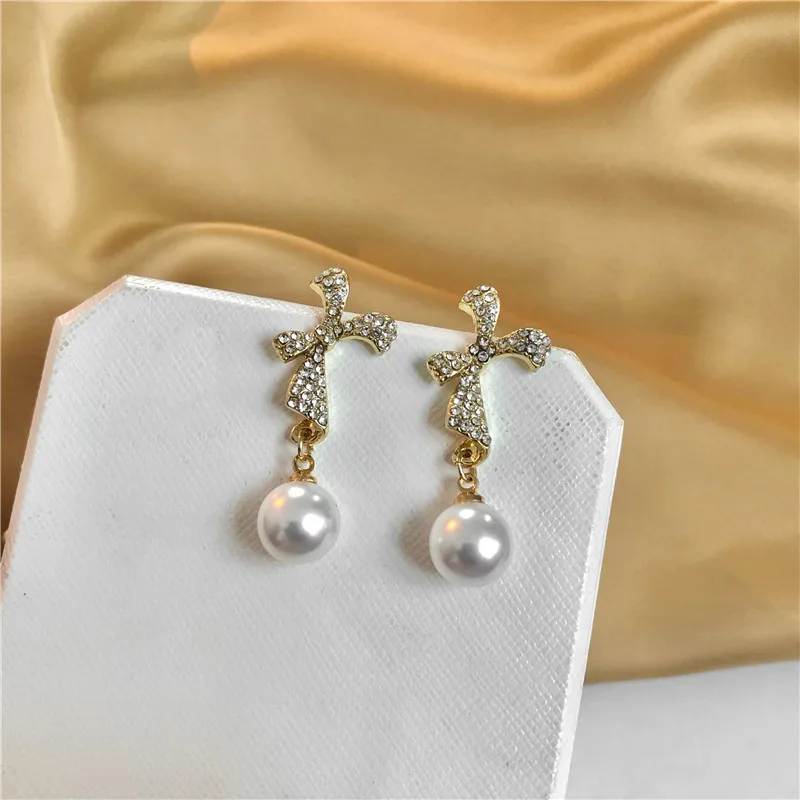 

Cute Pearls Bowknot Stereoscopic Clip on Earrings Rhinestone High Aesthetic Earrings