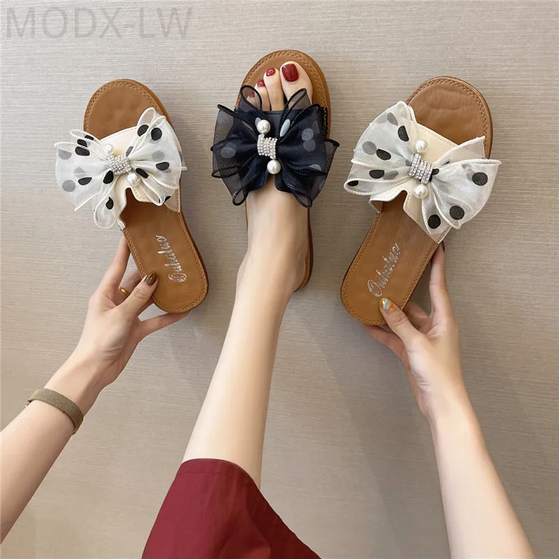 

Fashionable hot-selling outdoor flat-bottomed comfortable bow-knot decoration non-slip sandals women casual all-match slippers