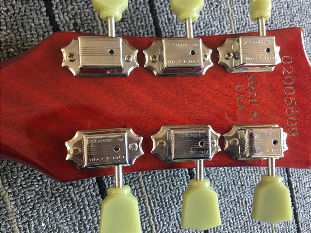 Китайский продукт Красная гитара Блочная инкрустация Бесплатная