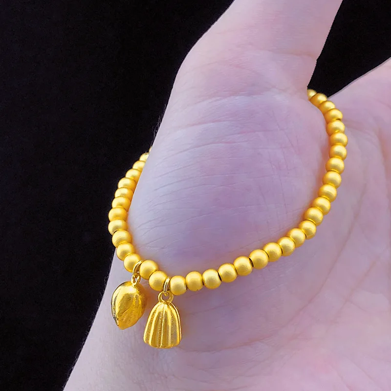 Браслет-цепочка цвета золота 24 карата с изображением цветка лотоса | Украшения и