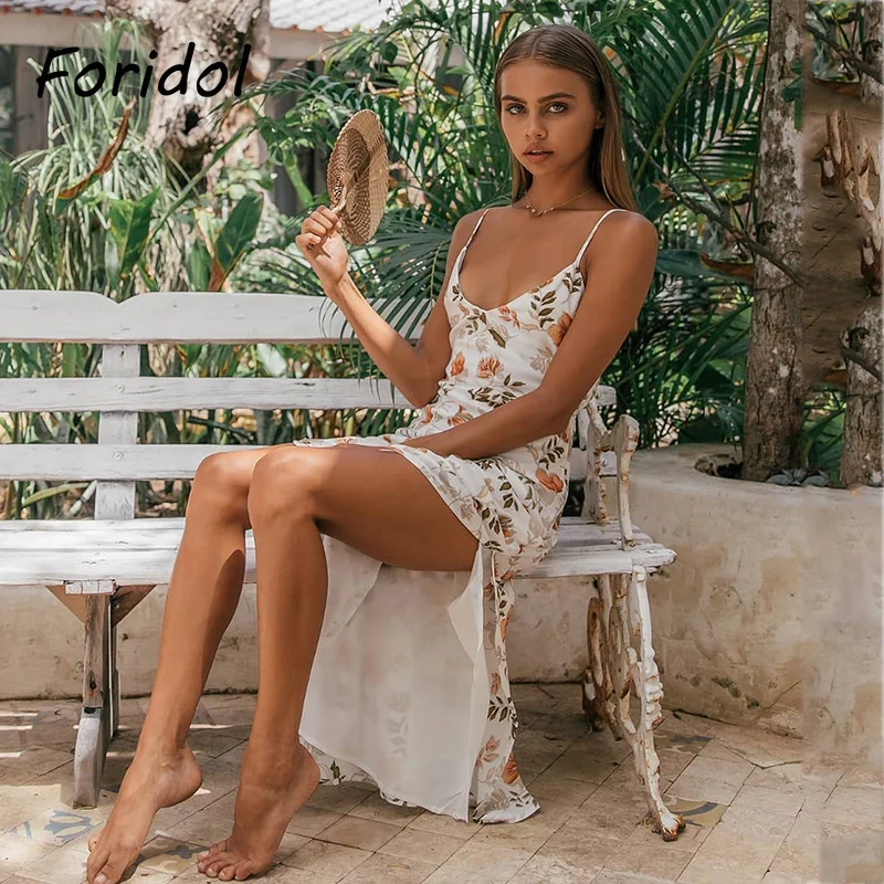 

Foridol Leaf Flower Print White Summer Beach Long Dress Women Spaghetti Strap High Slit Backless Bowknot Maxi Dress Sundress