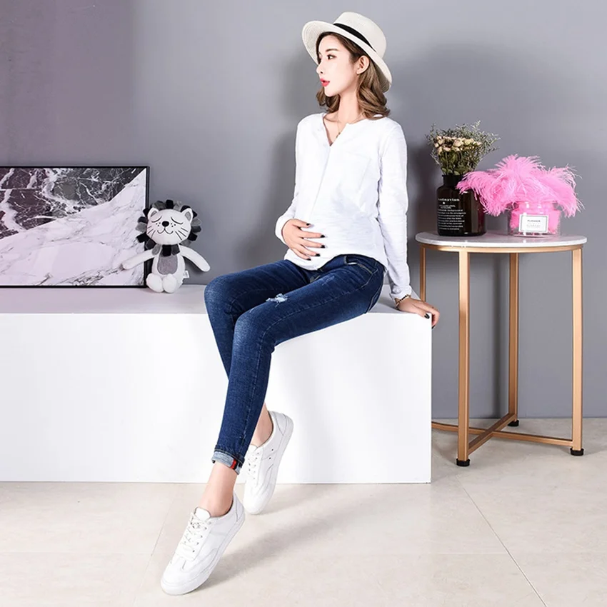 

Pregnant women jeans 2019 spring and autumn and winter new stomach lift denim trousers hole nine pants fashion stretch pants