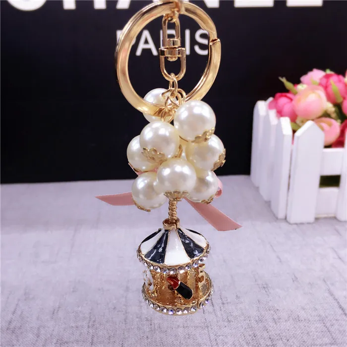 New Creative Fashion Carousel Key Chain Personality Trend Pearl Charm Key Chain Lady Cute Bag Mobile Phone Pendant Key Chain