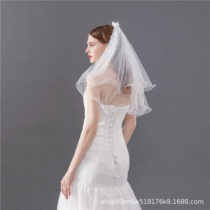 Белый бант двухслойная маленькая вуаль с боковым гребнем для волос фото тиара