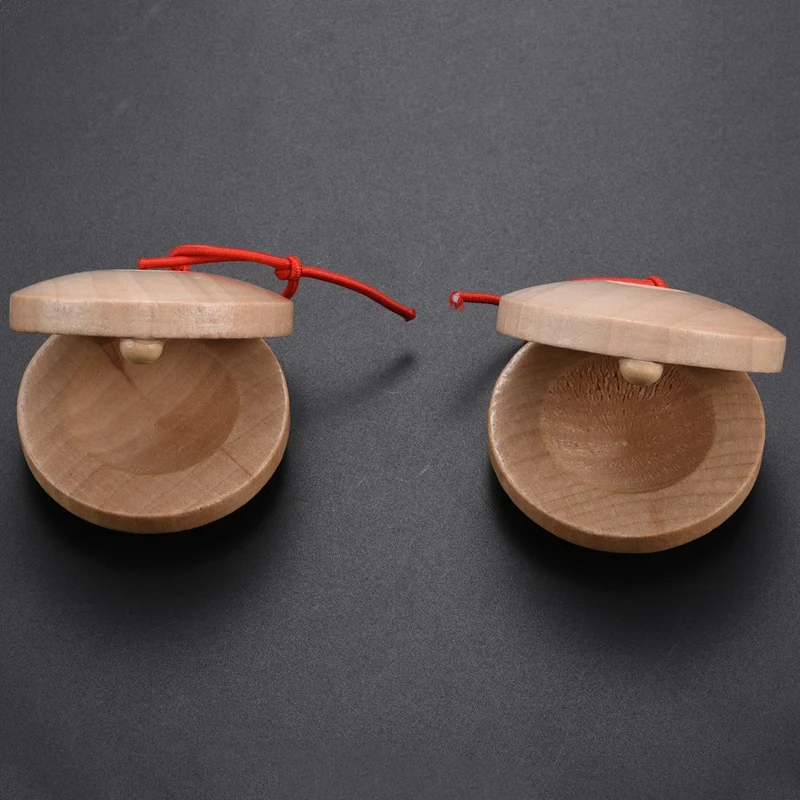 

A pair of wooden flamenco musical instrument castanets of wood color percussion instrument