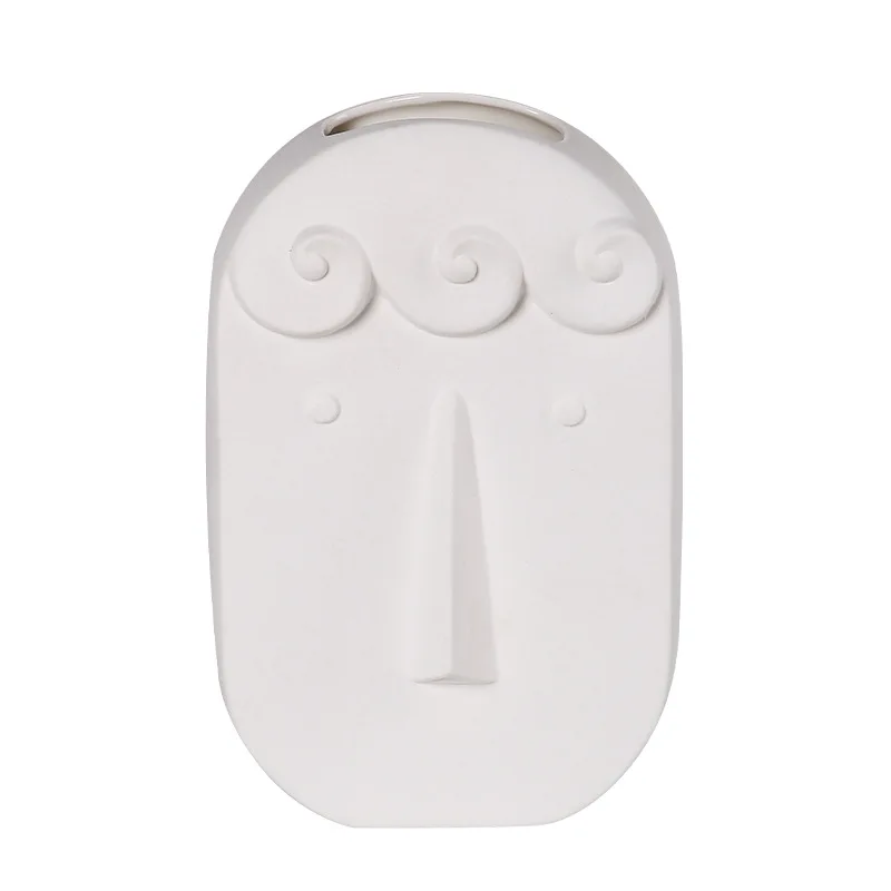 

A family of three ornaments for a living room flower arrangement ceramic face flower device
