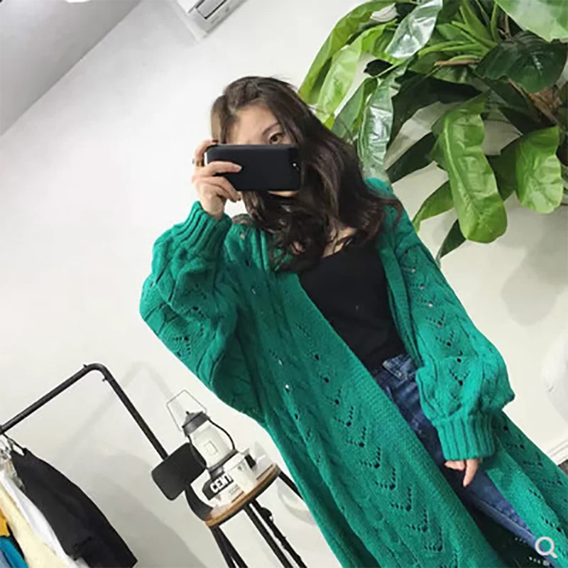 

2021 new loose V-neck solid color mid-length knitted sweater women's cardigan hollow jacket twist sweater