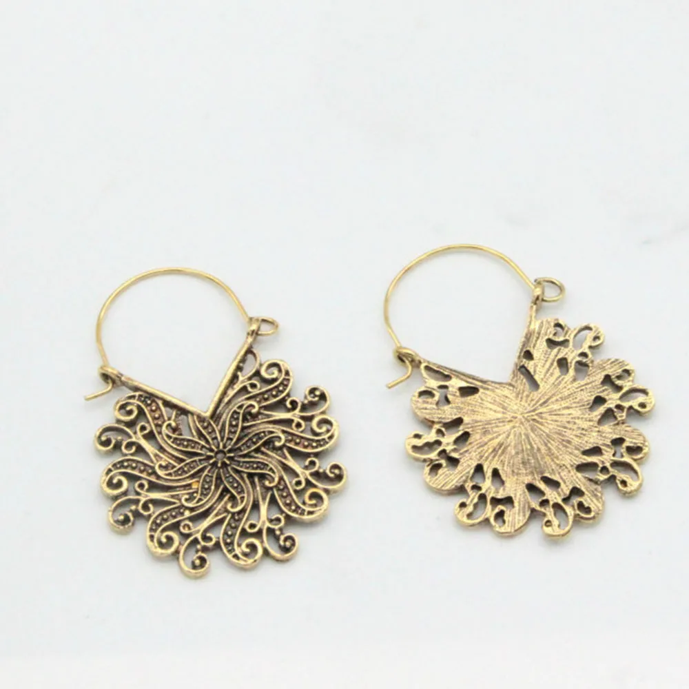 

New hot-selling personality fashion women's jewelry earrings wild retro hollow flower peacock alloy earrings earrings
