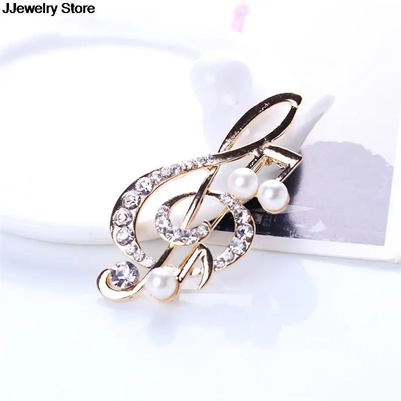 Элегантная брошь в форме музыкальной ноты с украшением виде кристаллов булавки