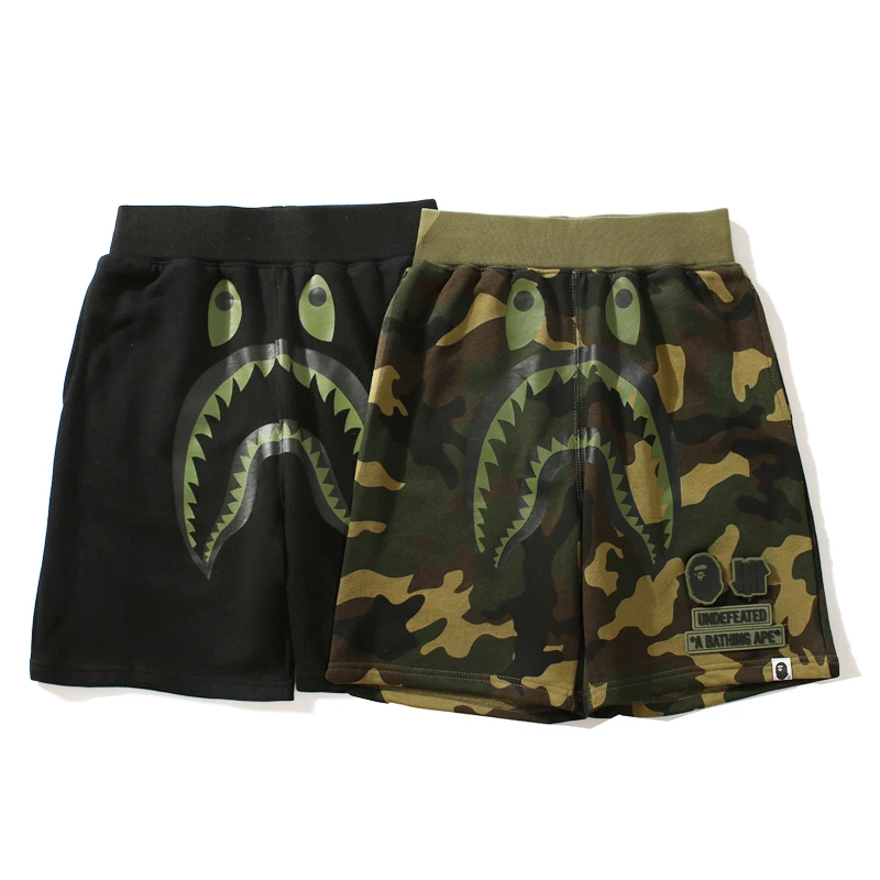 

Непобедимые шорты Bape x, уличная одежда, военные камуфляжные шорты для бега с акулами, свободные Стильные шорты с нашивкой и вышивкой логотип...