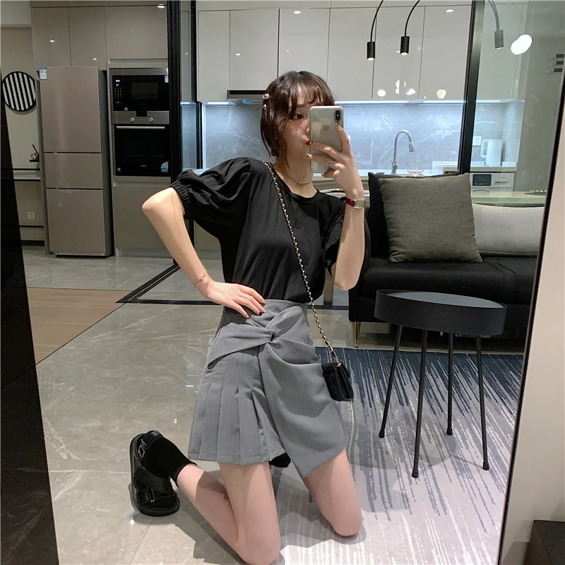 

2021 Women Irregular Hem Skirt Twist-Knot Decorated Asymmetric Pleated Skirt High Waist A-line Ladies Mini Black Skirt