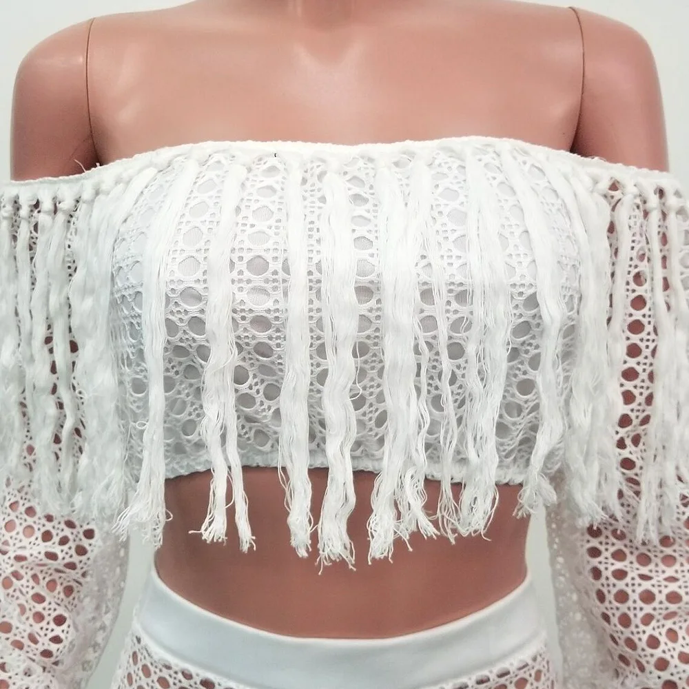 

Summer 2020 new hollowed-out sexy fashion mesh tassel see-through two sets of women's beach jacket high-waisted skirt