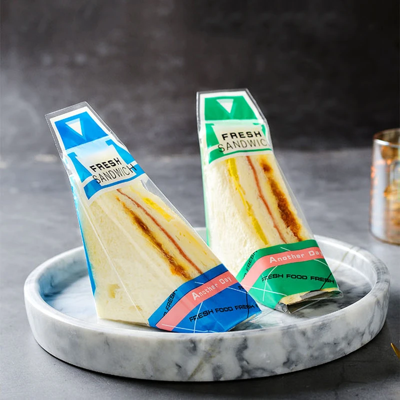 

Disposable Sandwich Packaging Bags 100PCS Transparent Bread Bag Plastic Triangle Bags Kitchen Tool Factory Wholesale