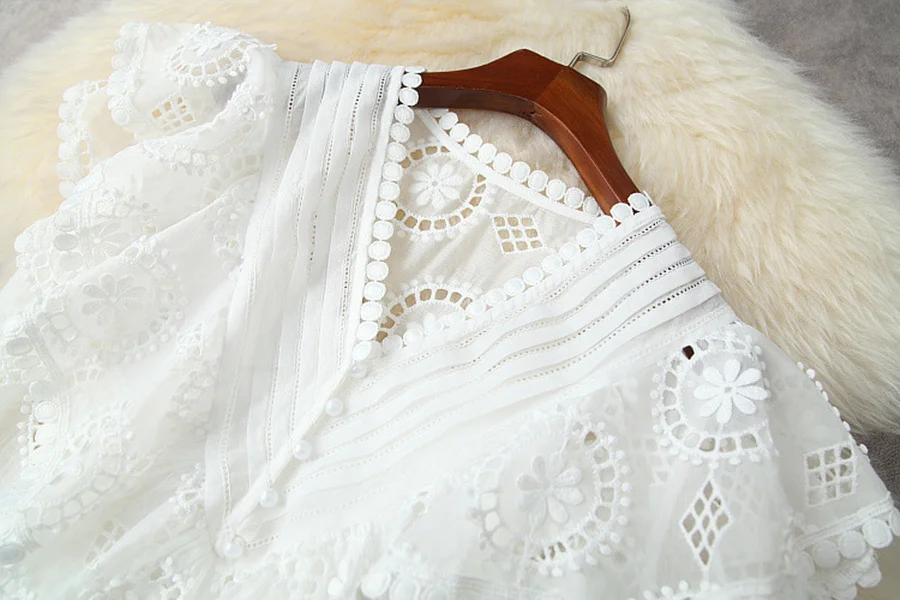 

European and American women's wear for summer 2021 Short sleeved V-neck hollowed-out shirt Flounce shorts Fashion suits