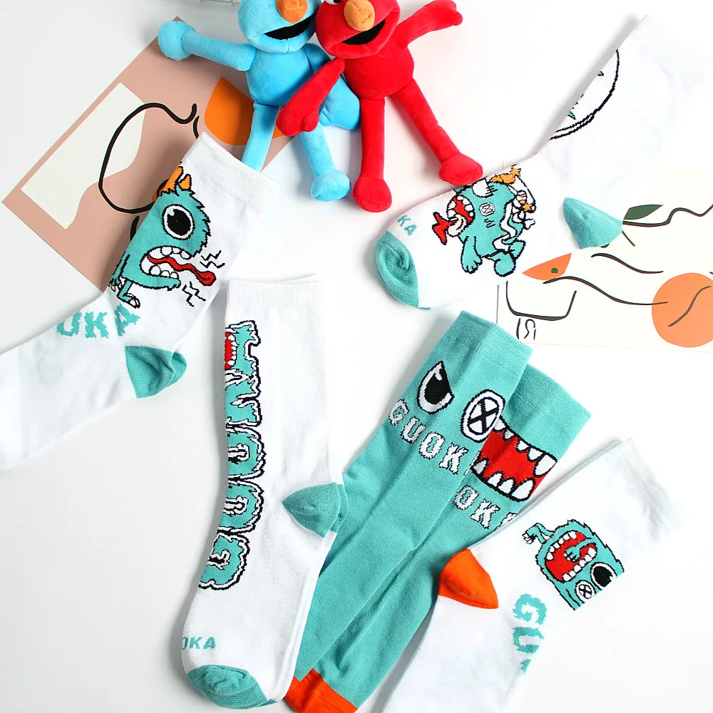 

Men and women socks cute cartoon little monster pattern funny socks European and American trend street skateboard socks