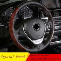 car steering wheel cover crystal mahogany leather braid on the steering wheel of car with needle and thread interior accessories