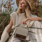 Элегантные женские с высоким, плотно облегающим шею воротником свитер жилет без рукавов с плечевыми накладками трикотажные пуловеры; Сезон осень-зима джемпер свободного покроя Модные топы