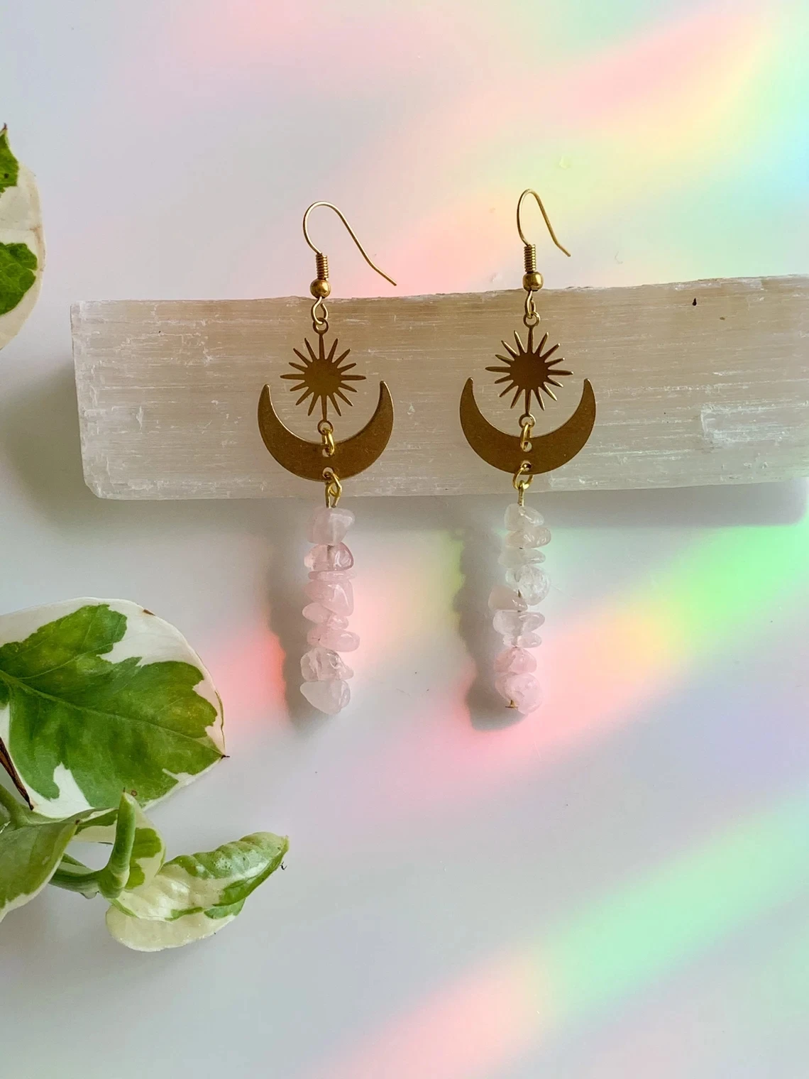 

The Rose quartz golden sun moon earrings. Rose quartz chip dangle earrings.