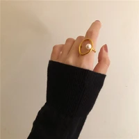 2021 fashion elegant lady design hollow out round shape geometric ring simple pearl gold color ring for women nightclub jewelry
