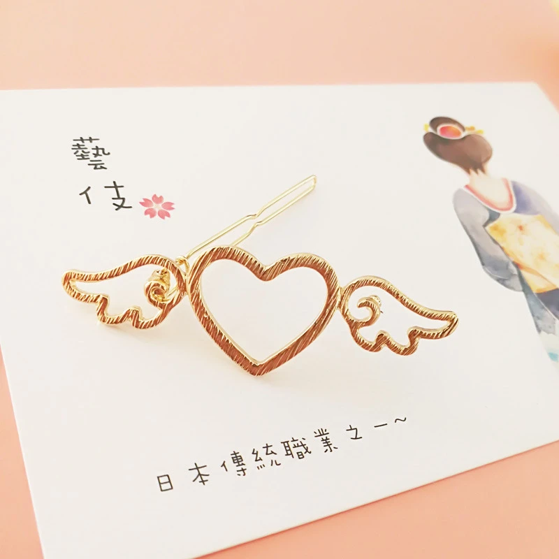 1 персональный ноутбук цвета металлик с украшением в виде крыльев Ангела любящее