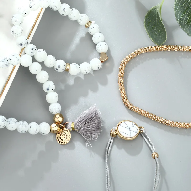 Simple and creative geometric hollow metal round piece turquoise love tassel pendant bracelet four-piece set | Украшения и