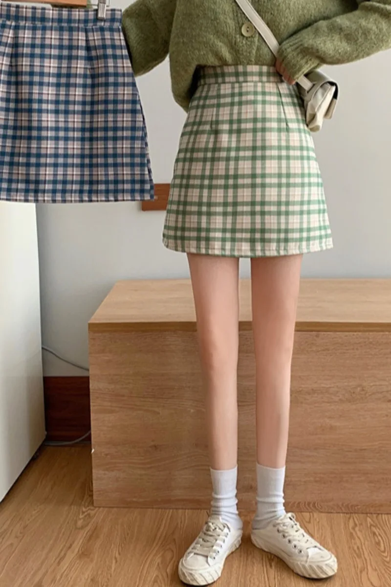 

Spring skirt female 2021 new a-line skirt Korean version loose high waist plaid retro bag hip skirt
