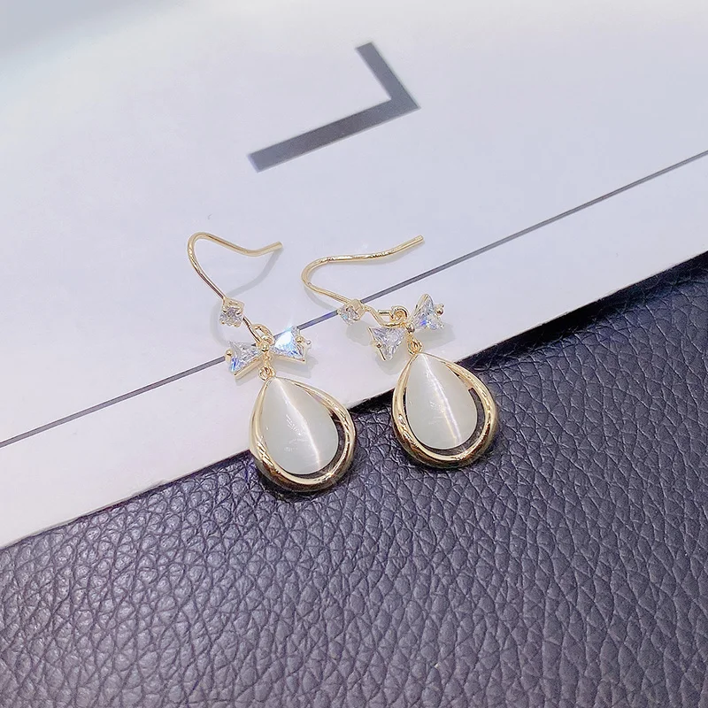 

Korean version of opal hanging earrings earrings female bow earrings ear hooks simple fashion temperament Fashion Stud Earrings