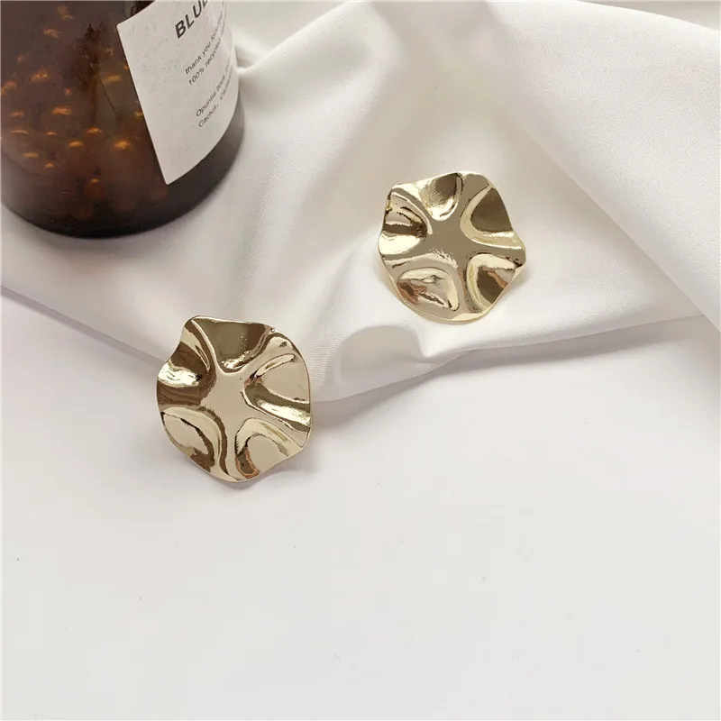 

Metallic simple sense restoring ancient ways is irregular lotus leaf earrings femininity and simplified geometric earring orname