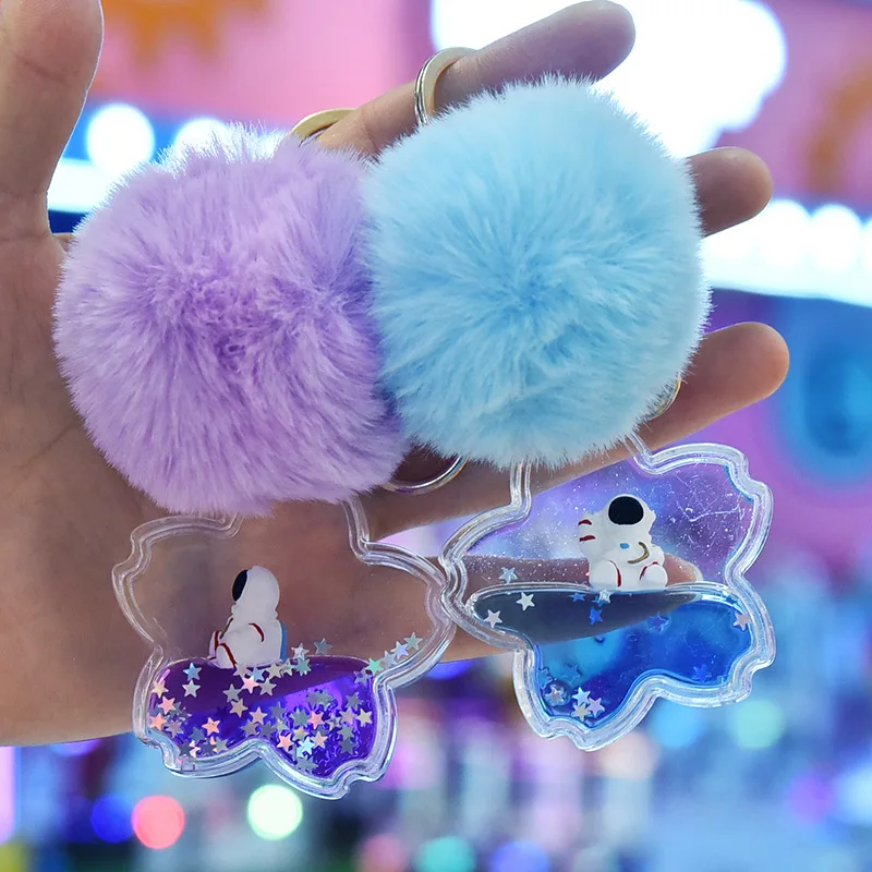 

Брелок с подвеской в виде астронавта и зыбучего песка