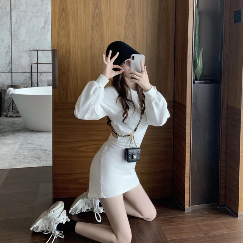

2021 autumn new fashion back hollow temperament niche long-sleeved dress waist guard dress.