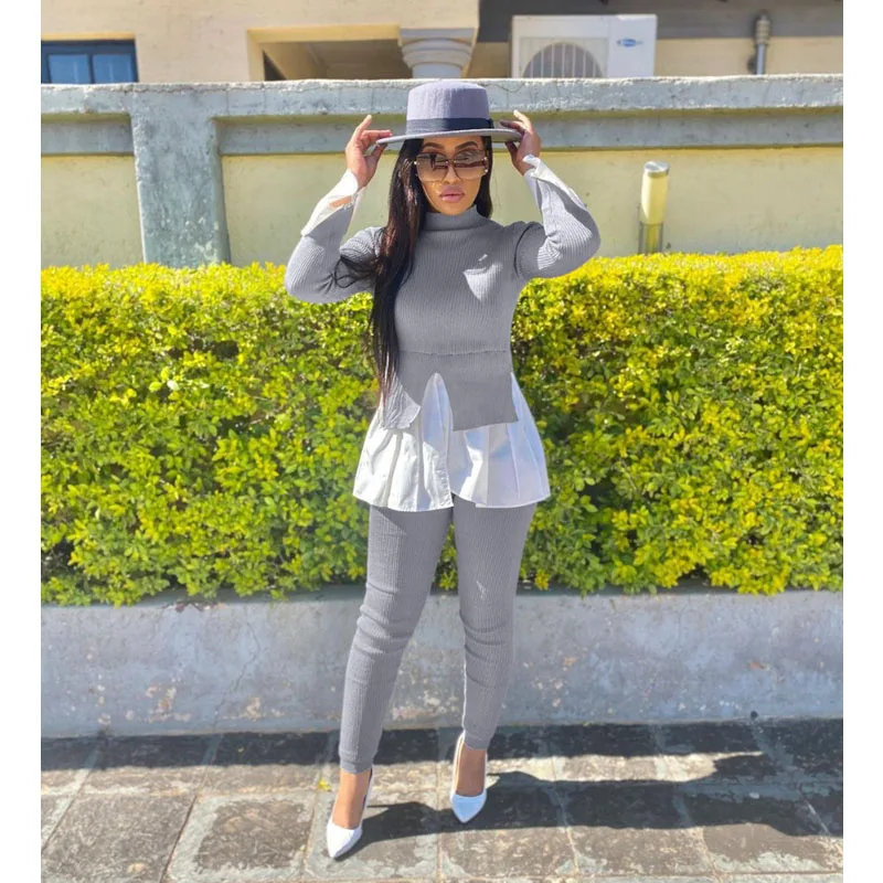 

Женский костюм из двух предметов: укороченный топ с пышными рукавами и брюки